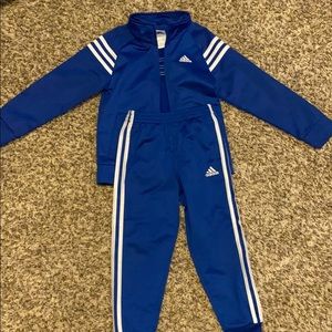 Adidas track suit.